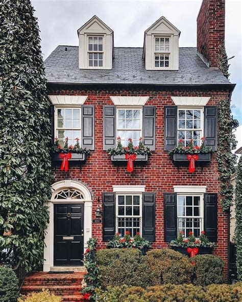 red brick house black shutters